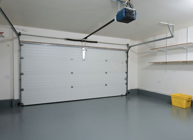 Garage door opener unit installed in a clean Brownsville garage